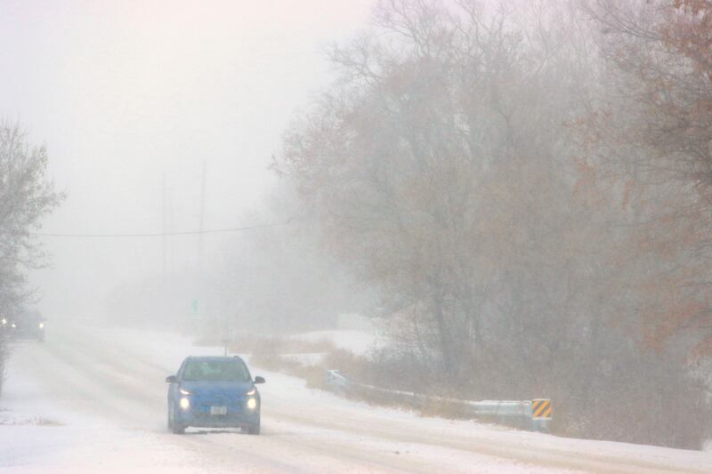 Motorists move along Route 20 in Marengo during a snow storm on Saturday, November 29, 2025.