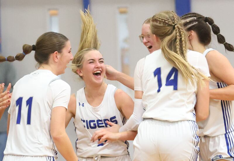Princeton's Kiyrra Morris reacts with teammates after hitting the game-winning shot over Illinois Valley Central in the Princeton High School Girls Basketball Holiday Tournament on Saturday, Nov. 22, 2025 at Princeton HIgh School. The Tigers won in double overtime.