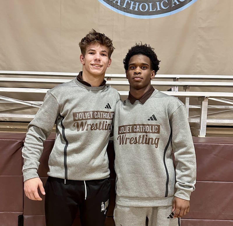 Joliet Catholic's Nolan Vogel and Jason Hampton (left to right) each recorded pins during Wednesday's wrestling dual against Marian Central.