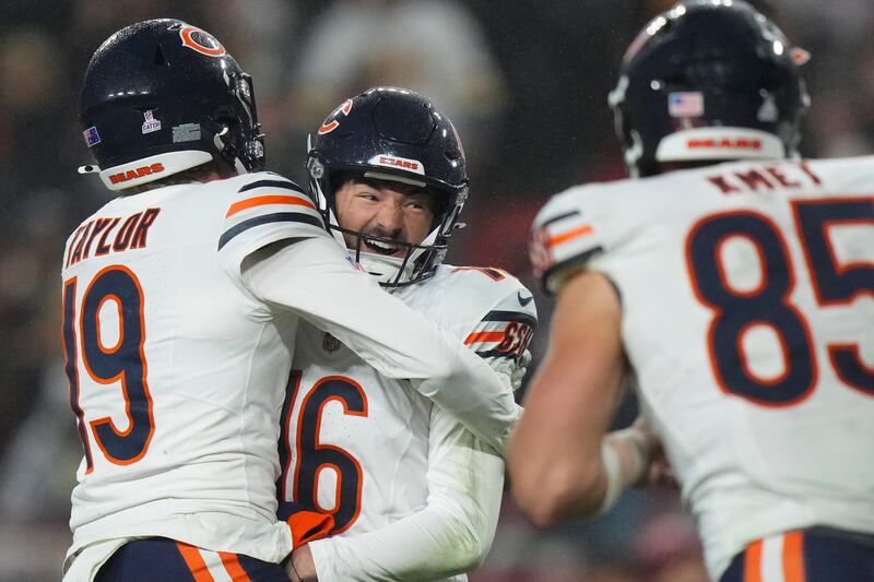 Chicago Bears kicker Jake Moody (16) celebrates the game-winning field goal with punter Tory Taylor (19) after an NFL football game against the Washington Commanders, Monday, Oct. 13, 2025, in Landover, Md. (AP Photo/Stephanie Scarbrough)