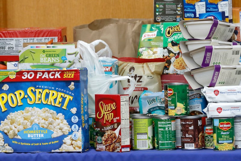 Donations are stacked on a table during a Community Harvest food drive on Friday, Nov. 19, 2021, at Northwestern Medicine Health and Fitness Center in Crystal Lake. About 40 sponsoring sites helped contribute to the annual food collection and donation campaign for the Crystal Lake Food Pantry.