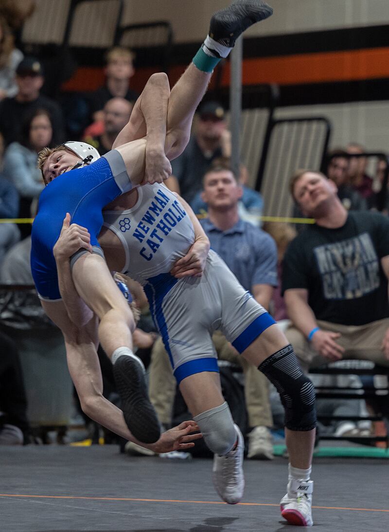 Newman’s Landon Near throws Princeton’s Augustus Swanson in the 113-pound first-place match Saturday, Feb. 14, 2026, during the Class 1A wrestling sectionals in Byron.