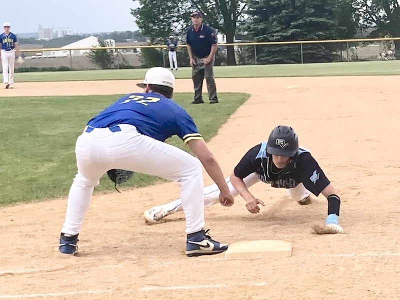 Bureau Valley senior Logan Philhower dives back safely to first base on a pick-off attempt Tuesday in Manlius. The Storm picked up a 10-0 Lincoln Trail Conference win over Galva.