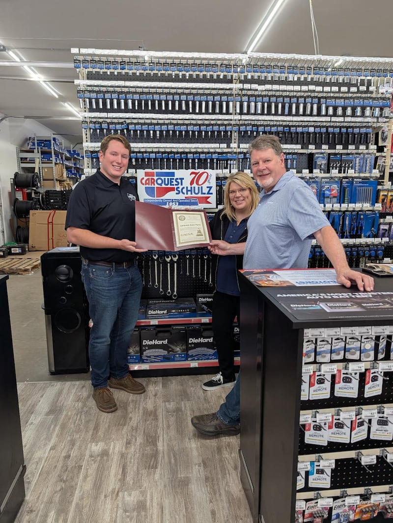 Carquest owners Marc Blanc (right) and Thelmarose Gerrits accept the June 2025 Business Highlight Award from state Rep. Brad Fritts.