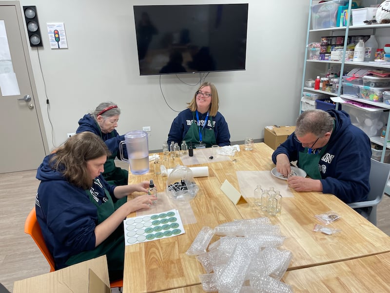 Clearbrook clients Angela Guth, Susan Lyman, Emma Rabe and Phillip Russel work on Naturally Gifted products.