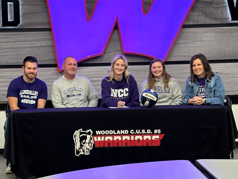 Recent Woodland graduate and 2024 Times All-Area Girls Volleyball first-teamer Malayna Pitte, seated at center surrounded by family at her signing ceremony, has signed on to continue her education at Illinois Valley Community College in Oglesby and her volleyball career at the NJCAA level with the Eagles.