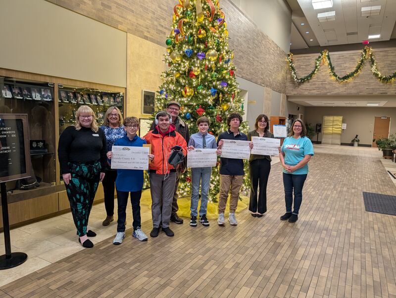 The winners of the Community Foundation of Grundy County's philanthropy essay contest with representatives from the organizations they chose to donate their winnings to.