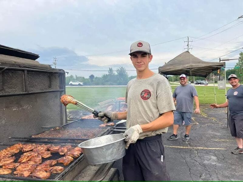 Timothy Fay grilling at the family business, Fay's Finest Foods, with Jon and Nathan Fay. The company will provide chicken, pork chop and walleye dinners from 3 to 7 p.m. Thursday, July 3 for a scholarship fundraiser the Kane County Farm Bureau, 2N710 Randall Road, St. Charles.