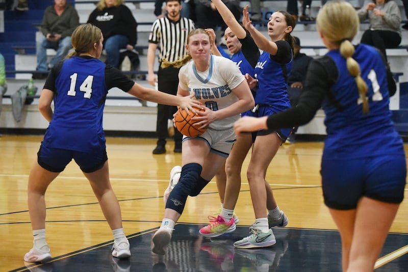 Cissna Park's Addison Lucht, center, drives through the Clifton Central defense during a game at Cissna Park Wednesday, Feb. 4, 2026.