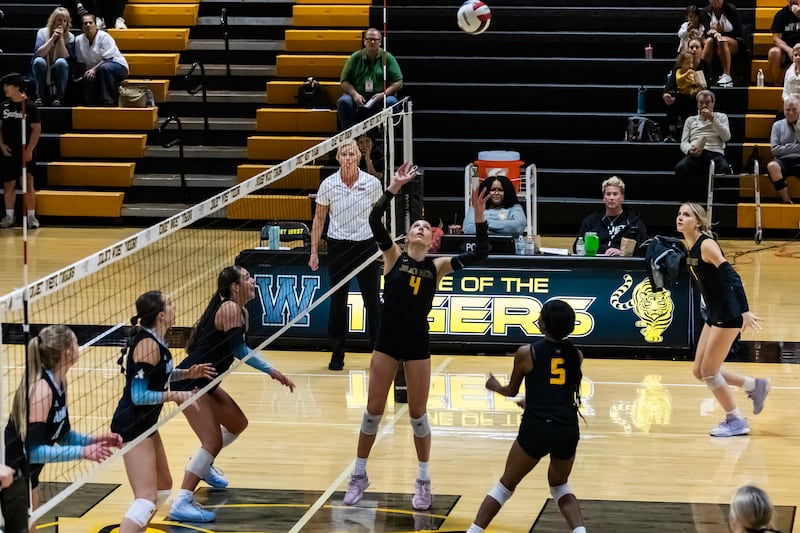 Joliet West's Lina Govoni sets-up a teammate during a varsity volleyball home game against Joliet Catholic on Sept. 4, 2025.