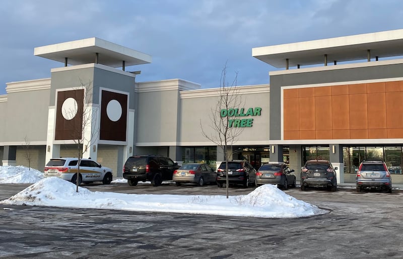 One McHenry County Sheriff's Office vehicle remained outside the Dollar Tree on Algonquin Road in Algonquin on Thursday, Jan. 27, 2022, after the agency advised of a large police presence and asked people to avoid the area,