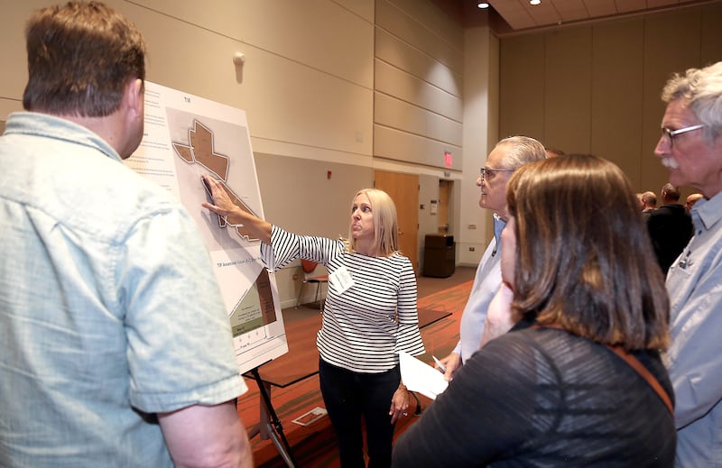 Jennifer Cowan, director of community development for Crown Community Development, talks about TIFs with attendees at The Grove community engagement meeting on Monday, June 12, 2023 at Waubonsee Community College in Sugar Grove.