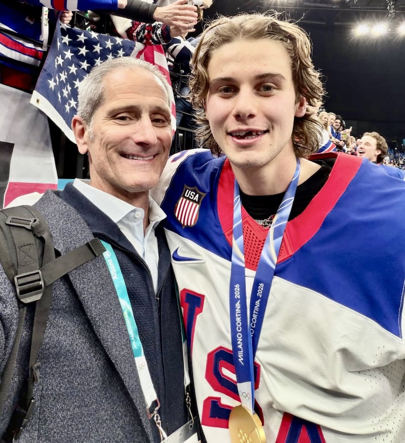 Dr. Mike Stuart, a 1975 St. Bede alum, poses with USA Olympic hero Jack Hughes after his gold-medal winning overtime goal over Canada in the Winter Games in Milan, Italy. Stuart is the team physician and has worked five Winter Olympics dating back to 1994.