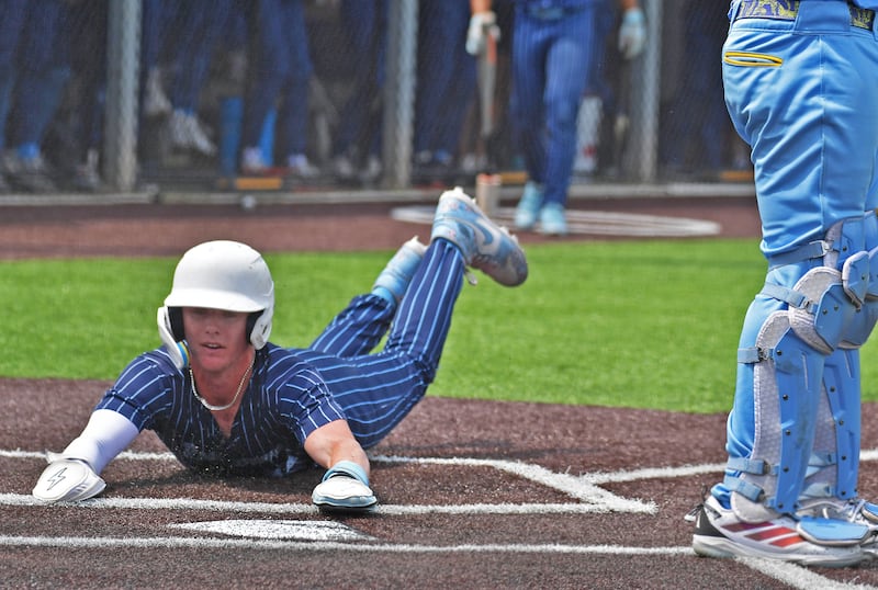 Nazareth’s Landon Thome slides home with the go ahead run against De La Salle in the bottom of the sixth inning of the Class 3A Nazareth Sectional final on June 6, 2026 at Nazareth Academy in La Grange Park.