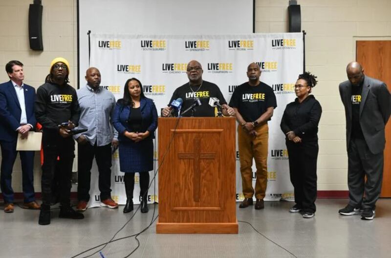 The Rev. Michael Prude speaks on Monday during a press conference at Second Baptist Church held in the wake of the shooting on New Year’s Day in Kankakee that left two dead and five injured. Community leaders and officials along with the mother of the two victims called for a stop to the violence, and announced the establishment of a healing center with the help of a national organization called Live Free USA.