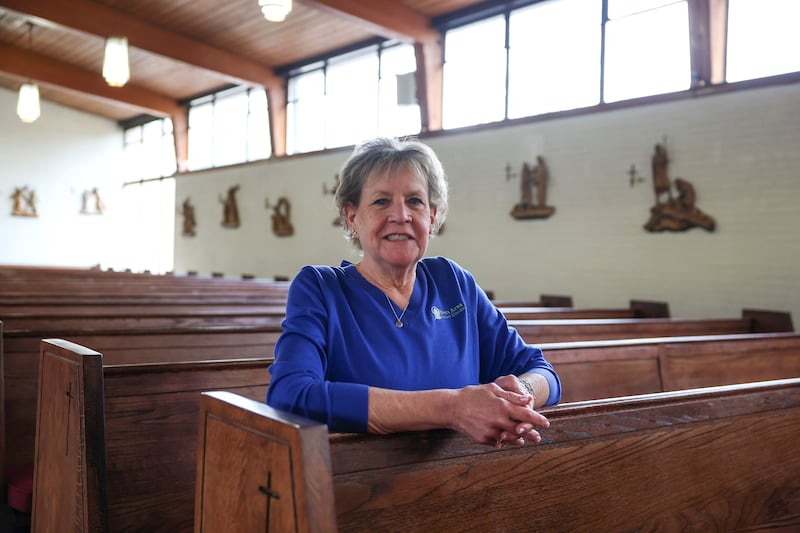 Kankakee City Council member Danita Grant Swanson sits in the pews where her family attends church at John Paul II Catholic Church in Kankakee. Swanson, who is battling a Stage 4 cancer diagnosis, said she believes in the power of prayer and has found strength in her faith.