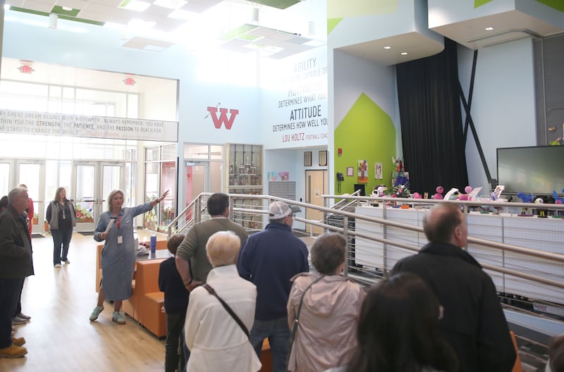 Waltham School superintendent Kristi Eager leads a tour of Utica residents inside the school on Thursday, March 27, 2025 in Utica.
