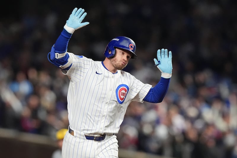 Chicago Cubs' Ian Happ (8) runs the bases after hitting a 3-run home run during the first inning of Game 4 of baseball's National League Division Series against the Milwaukee Brewers Thursday, Oct. 9, 2025, in Chicago. (AP Photo/Nam Y. Huh)