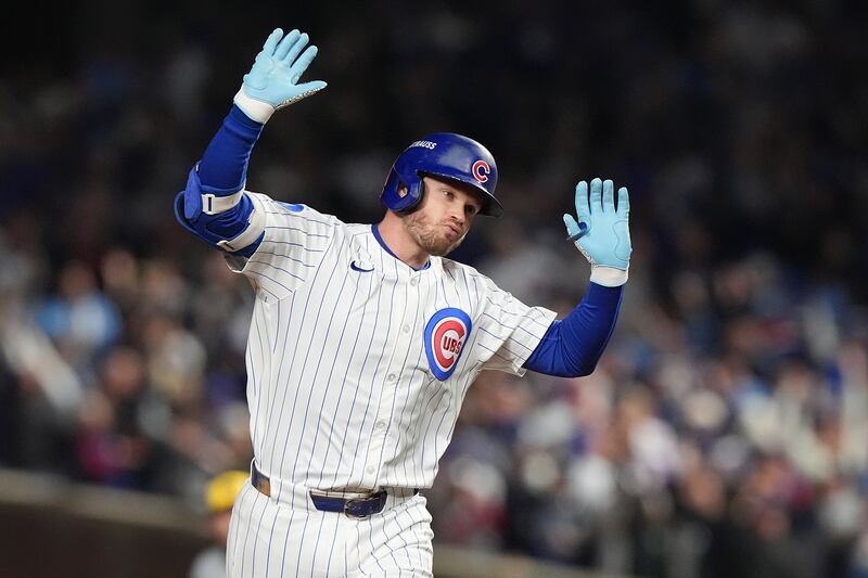 Chicago Cubs' Ian Happ (8) runs the bases after hitting a 3-run home run during the first inning of Game 4 of baseball's National League Division Series against the Milwaukee Brewers Thursday, Oct. 9, 2025, in Chicago. (AP Photo/Nam Y. Huh)