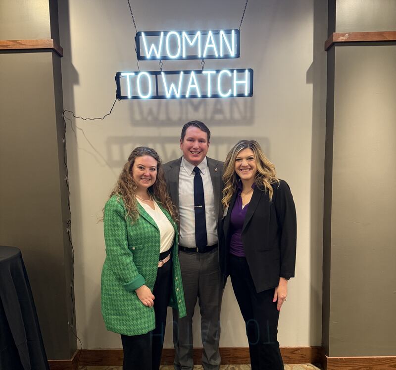 State Rep. Brad Fritts (center) celebrates with Dallas Knack (left) and Dr. Jennifer Hintzsche on Wednesday, April 23, 2025, at the Women to Watch Event in Springfield.