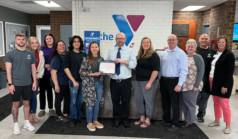 Streator Area Chamber of Commerce representatives and Streator Family YMCA staff pose for a photo after the YMCA was recognized as the chamber’s May Business of the Month.