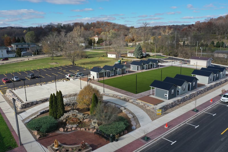 Want to do some holiday shopping at Utica's forthcoming outdoor retail plaza? Mayor David Stewart said he hopes the project will be completed in early to mid December, leaving shoppers a few weeks to buy presents for their families. Crews from the Utica Public Works department are building wooden decking on the corners of the site next to the huts at the Market on Mill, seen here in an aerial photo Tuesday, Nov. 12, 2024.