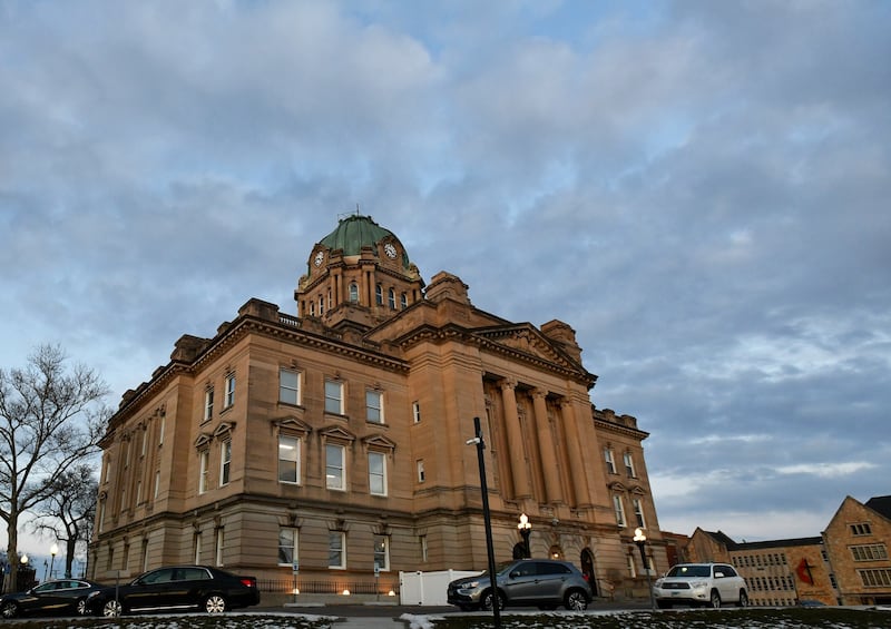 The sun sets behind the Kankakee County Courthouse.