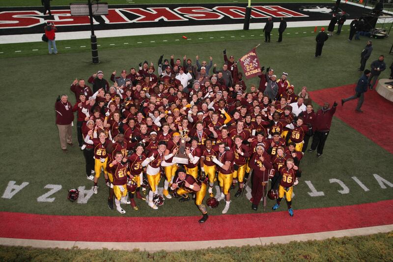 The 2015 Montini Catholic High School football team celebrates its state championship at Northern Illinois University's Huskie Stadium