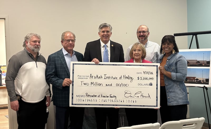 Darin LaHood presents a $2 million federal funding check to leaders of Arukah Institute on Tuesday, March 31, 2026, in Princeton. The funding will support renovations to expand mental and behavioral health services at the facility.