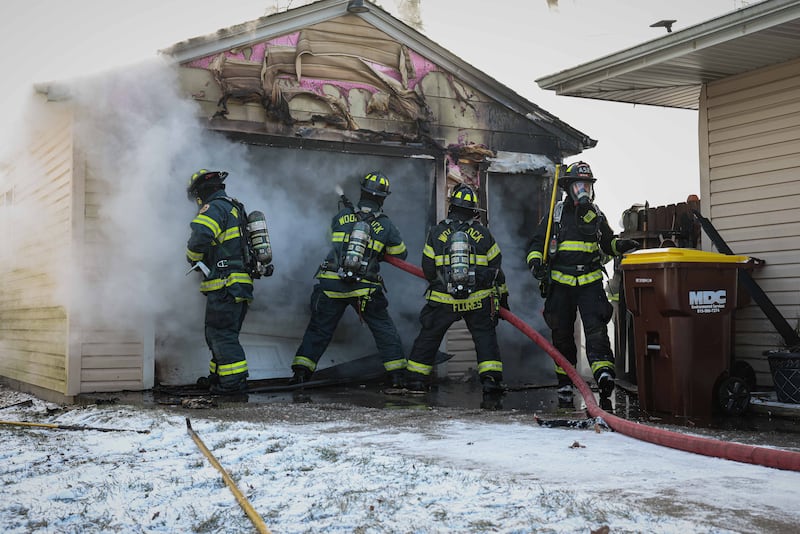 The Woodstock Fire/Rescue District puts out a fire that broke out in a detached garage on Jan. 14, 2026 at the 1300 block of Clay Street, Woodstock.