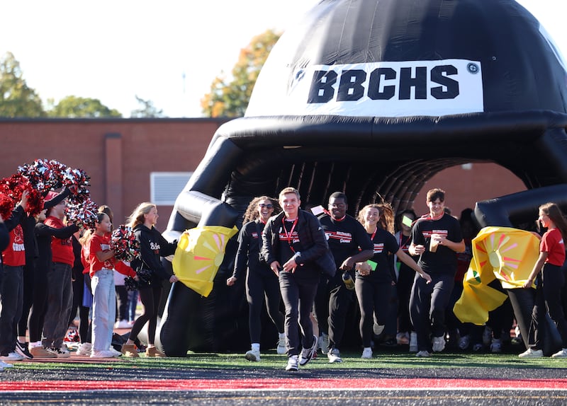 Bradley-Bourbonnais student Blake Dunham leads the Boilermakers out of the tunnel to kick off the annual Boilermaker Games, hosted by the Best Buddies club on Wednesday, Oct. 8, 2025, at Bradley-Bourbonnais Community High School.