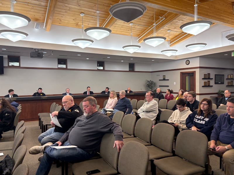 Audience members listen as Lake in the Hills Village Board meets Thursday, Feb. 26, 2026.