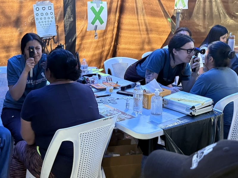 Volunteers with I Care International perform eye exams during their recent trip to Guatemala.
