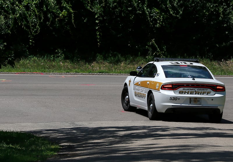 McHenry County Sheriff car near the location of where a 15-year-old boy was fatally hit by a car the night before. Police said the driver fled the scene.