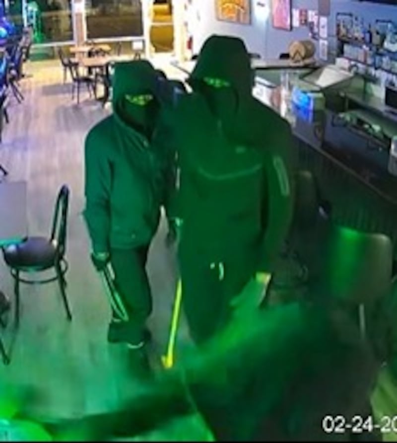 Suspects in a recent break-in at Stella's Cafe in Crest Hill are seen in this photo captured by security cameras. They were described as wearing dark clothing, wearing face coverings and gloves.