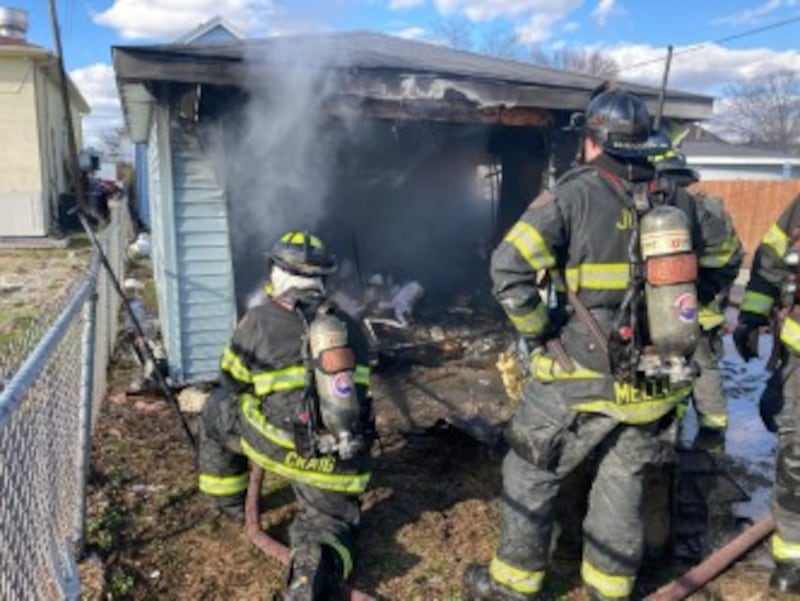 Joliet firefighters at the scene of a garage fire in the 400 block of Ohio Street on Friday, March 27, 2026.