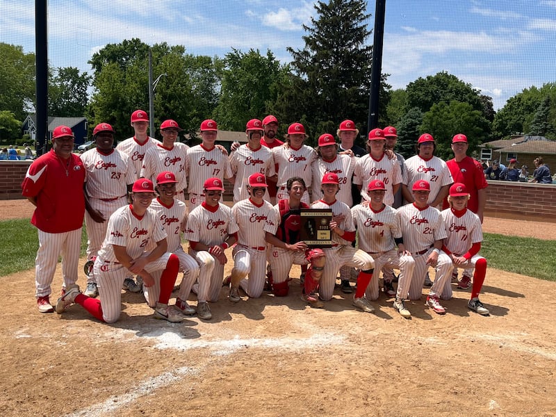 The Aurora Christian team poses with the regional plaque after beating Yorkville Christian 9-8 in eight innings to win the Class 1A Hinckley-Big Rock Regional title.