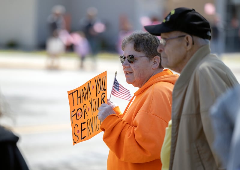 Karen Elgin of Rock Falls thanks the passing veterans with a sign Saturday, April, 26, 2025. Dixon VFW Post 540 held a Vietnam veteran parade down Galena Avenue to recognize those veterans who didn’t receive the thank you they deserved.