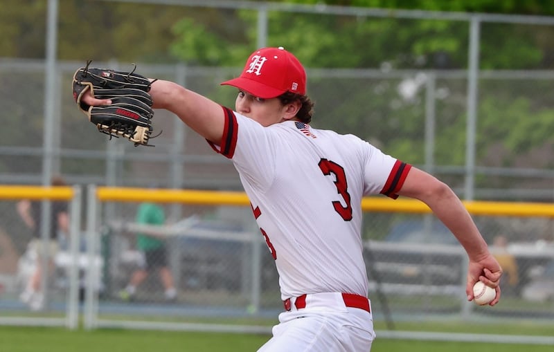 Hall's Jack Jablonski fires a pitch at Princeton Monday. The Red Devils won 10-4.
