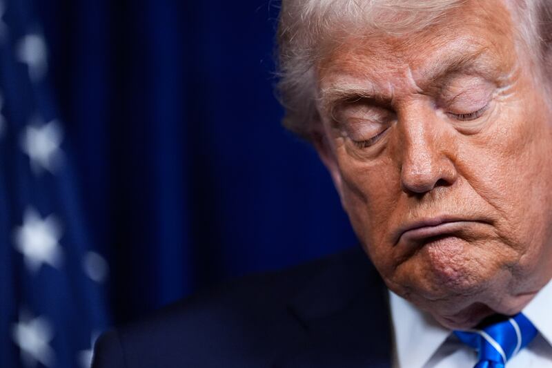 President Donald Trump closes his eyes during a joint news conference with Ukraine's President Volodymyr Zelenskyy following a meeting at his Mar-a-Lago club, Sunday, Dec. 28, 2025, in Palm Beach, Fla. (AP Photo/Alex Brandon)