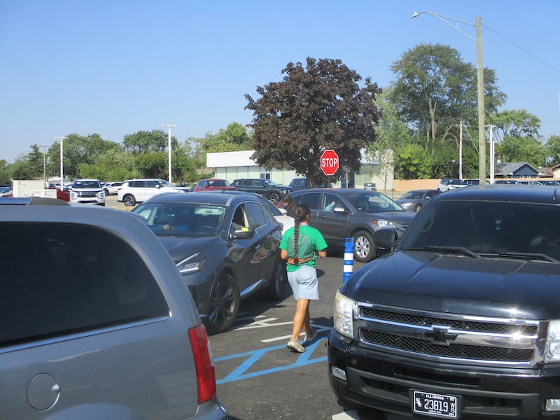 Cars creep up to the drive-thru at the new 7 Brew in Joliet after waiting in a line that stretched nearly the entire length of Barney Avenue on Saturday. Oct. 4, 2025