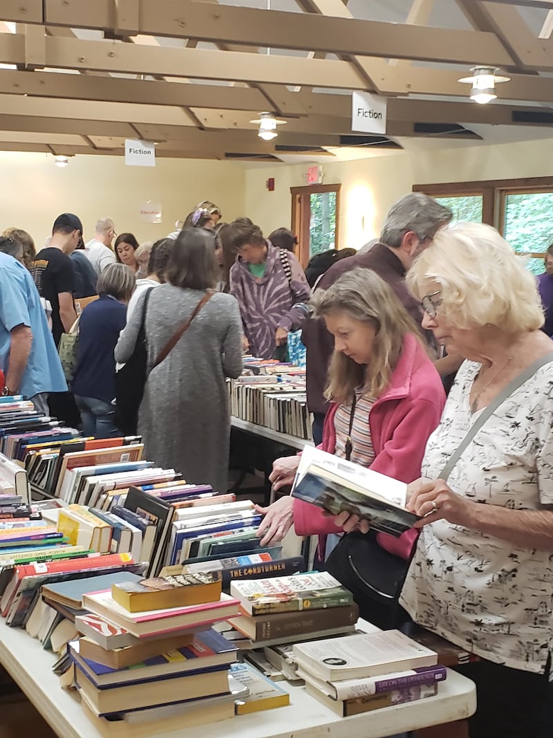 Will County residents browse donated books at the 2024 Book Reuse and Recycling event at Pilcher Park.