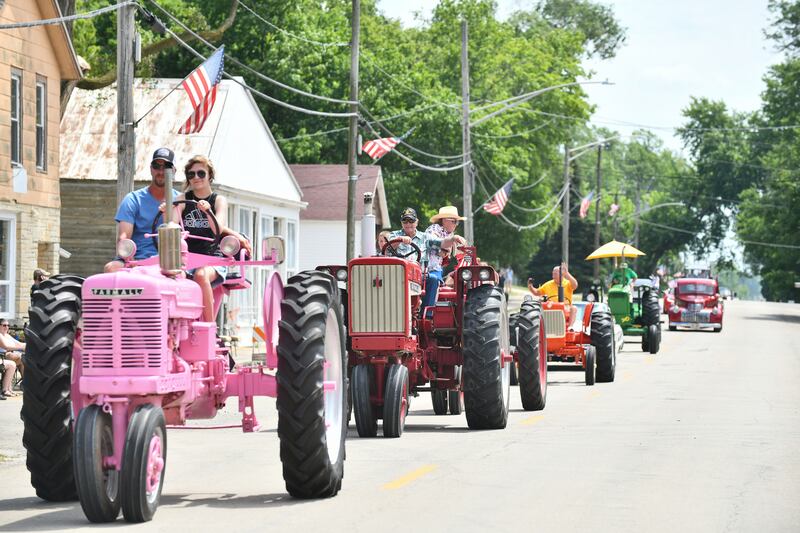Tractors make their way down Smith Street in Bonfield as part of the parade during the village's 2024 celebration on June 22, 2024.