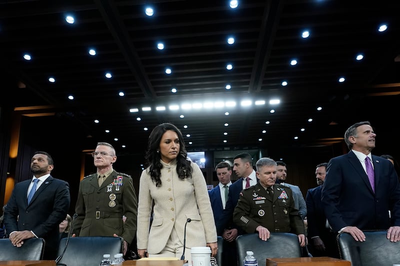 From left, FBI Director Kash Patel, Defense Intelligence Agency Director James Adams, Director of National Intelligence Tulsi Gabbard, Acting Commander of the U.S. Cyber Command William Hartman, and CIA Director John Ratcliffe stand before the Senate Committee on Intelligence hearings to examine worldwide threats on Capitol Hill Wednesday, March 18, 2026, in Washington. (AP Photo/Jose Luis Magana)