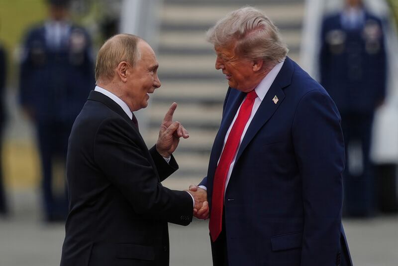 President Donald Trump greets Russia's President Vladimir Putin Friday, Aug. 15, 2025, at Joint Base Elmendorf-Richardson, Alaska. (AP Photo/Julia Demaree Nikhinson)