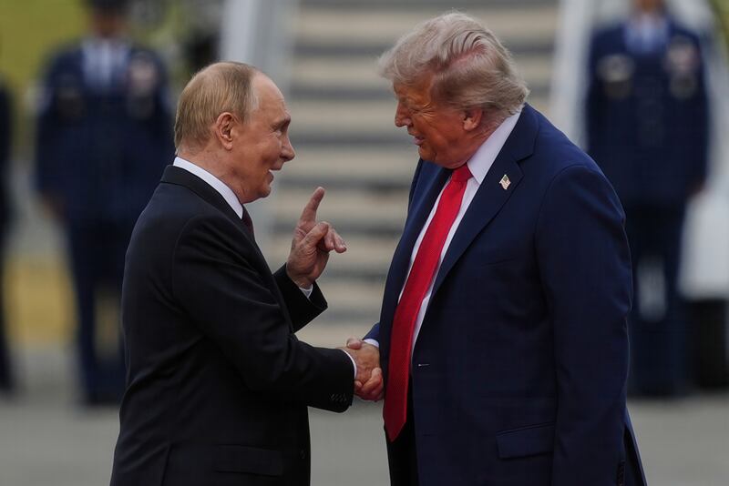 President Donald Trump greets Russia's President Vladimir Putin Friday, Aug. 15, 2025, at Joint Base Elmendorf-Richardson, Alaska. (AP Photo/Julia Demaree Nikhinson)