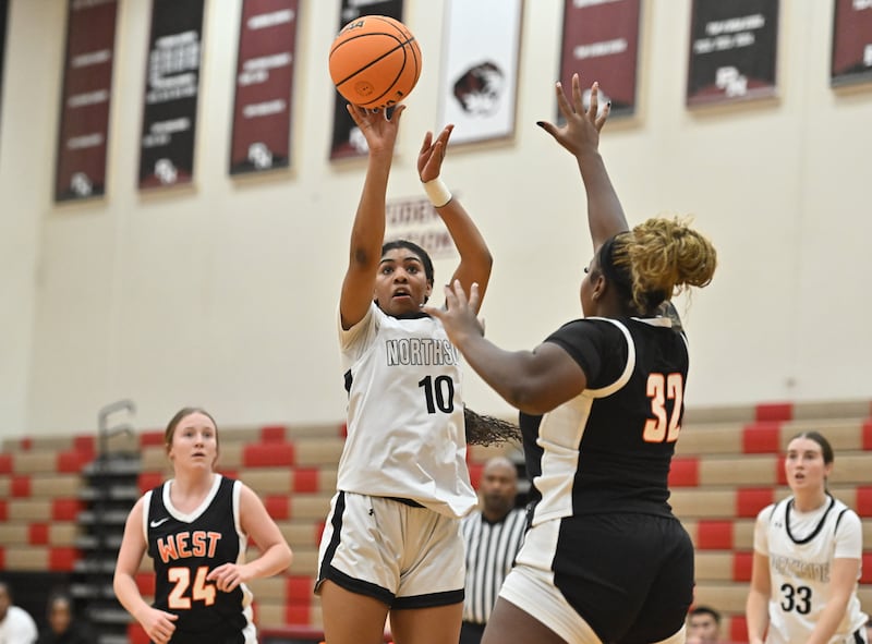 Plainfield North's Khamiaya Larry (10) shoots a jump shot over Lincoln-Way West's Heaven Ward (32) during the non-conference game on Monday, DEC. 15, 2025, at Plainfield.