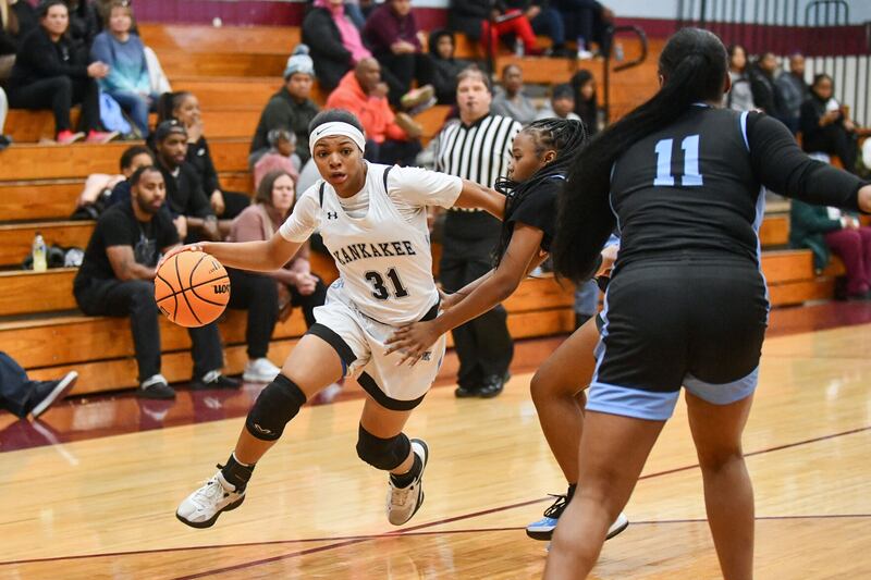 Kankakee’s TaLeah Turner drives around a defender Monday night during the Kays’ victory over Thornridge at Kankakee High School.