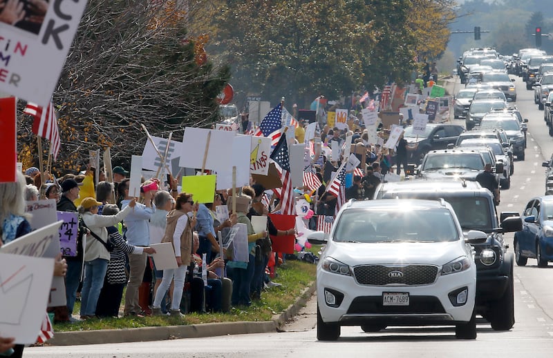 Protesters line Route 31 during a "No Kings” protest rally on Saturday, Oct. 18, 2025, in McHenry. The protest drew thousands of protesters to the area to protest the policies of President Donald Trump.