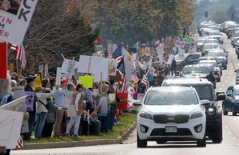 Protesters line Route 31 during a "No Kings” protest rally on Saturday, Oct. 18, 2025, in McHenry. The protest drew thousands of protesters to the area to protest the policies of President Donald Trump.